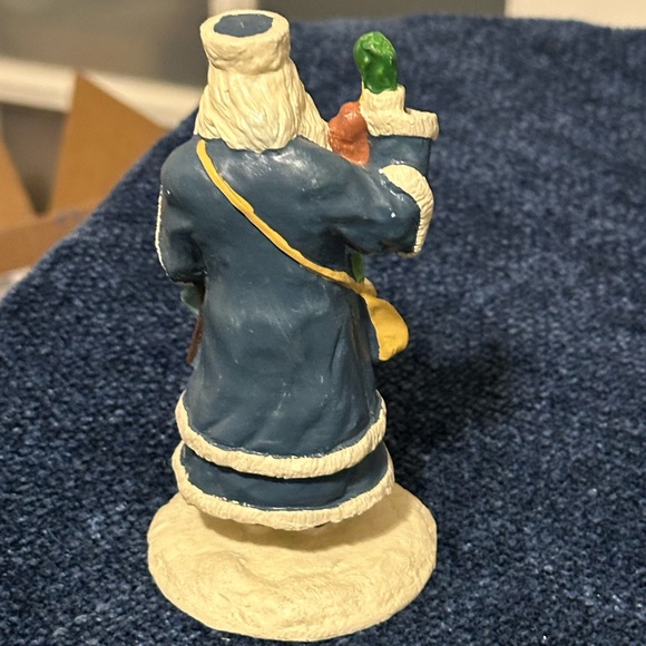 Blue robed Santa with green mittens holds a doll & basket of fruit. - Picture 3 of 7